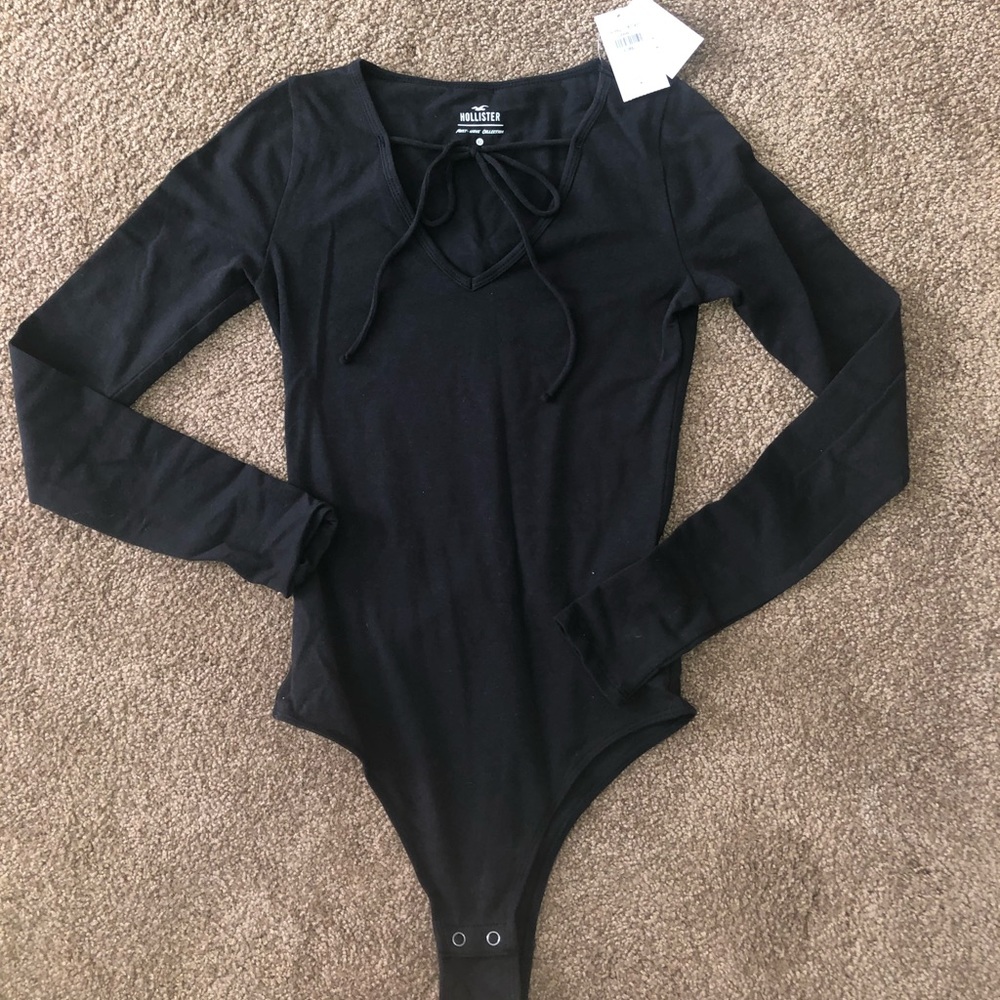 Brand New Never Worn Longsleeve Black Bodysuit.